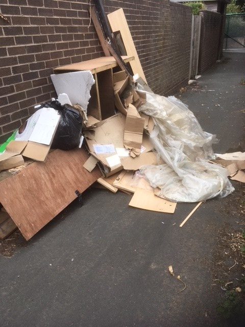 Woman fined after furniture left in entry